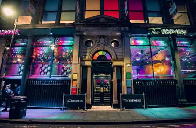Iconic Bar facade with festive lighting, perfect for casual networking and evening receptions.
