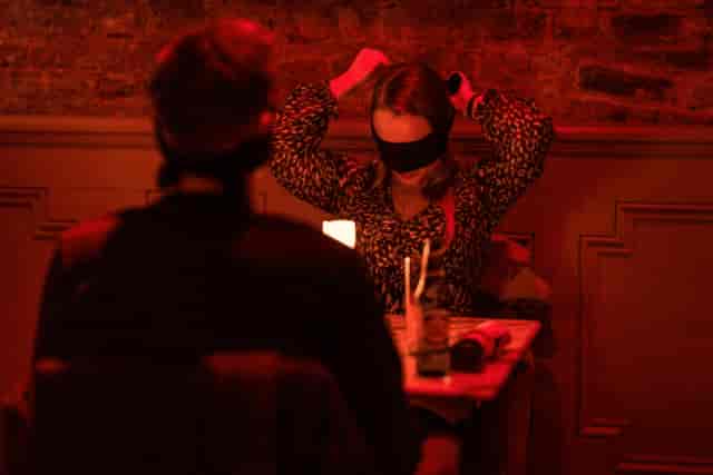 Dining in the dark restaurant event featuring sensory activation and networking atmosphere.