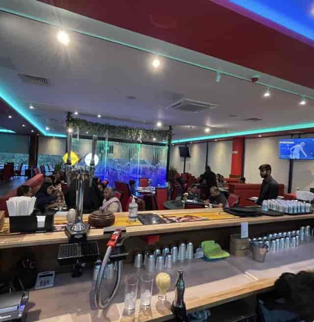 Sankalp restaurant event space with booth seating for corporate networking and social receptions.
