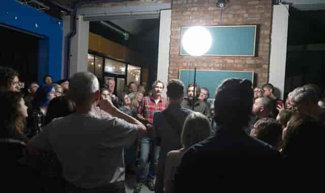 Low Four studio warehouse event with ambient lighting; ideal for creative workshops and photo shoots.