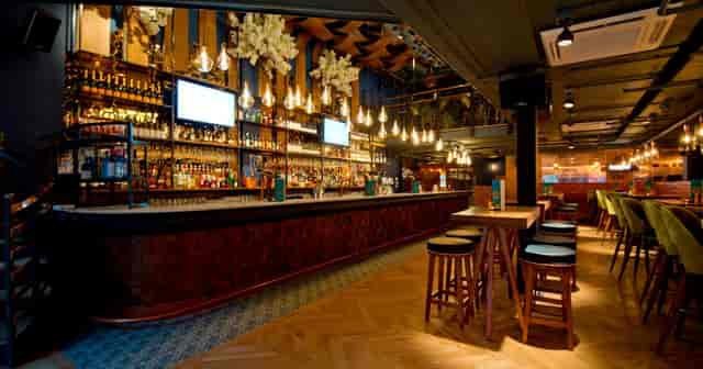 Atmospheric Banyan Bar & Kitchen interior for corporate cocktail or networking events.