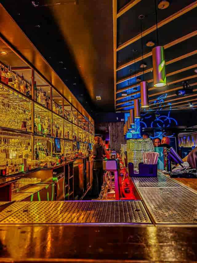 Cocktail masterclass at Be At One Manchester, featuring a stocked bar for corporate networking.