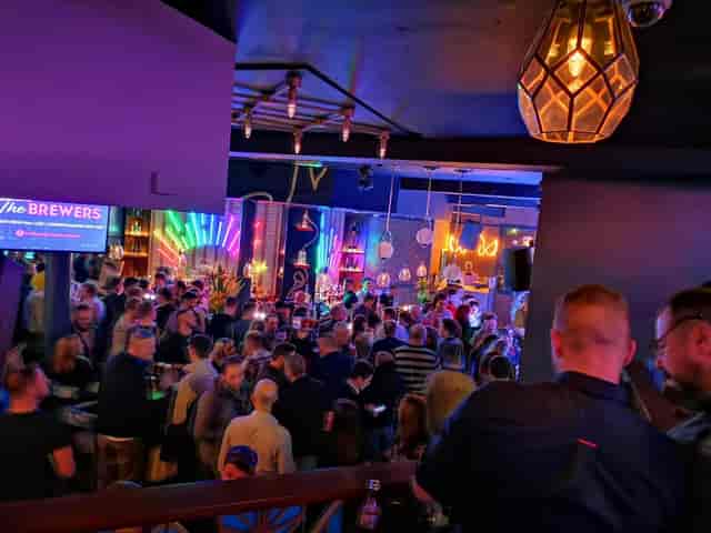 Lounge at The Brewers Manchester with neon lighting for corporate networking and business mixers.