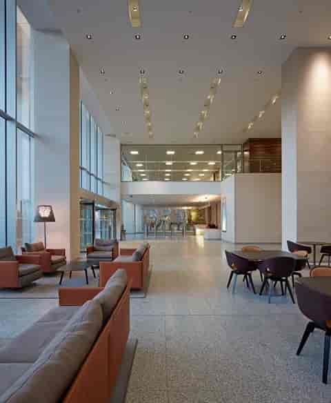 Modern lobby with high ceilings at One St Peter’s Square for corporate event networking.