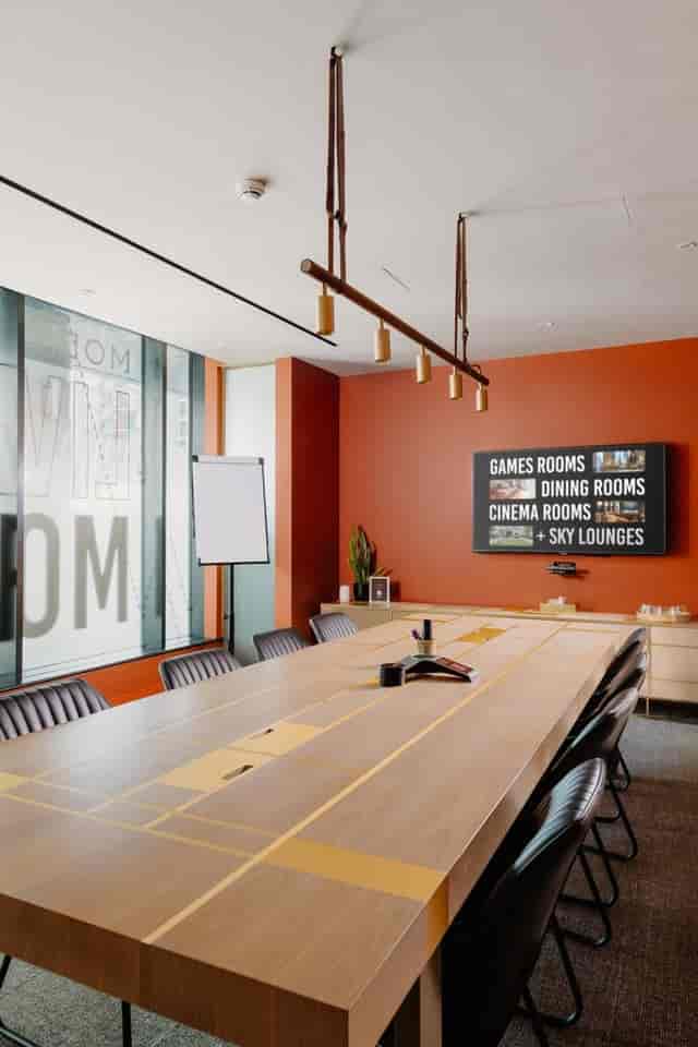 Modern boardroom at Angel Gardens with digital screen for corporate meetings and team collaboration.