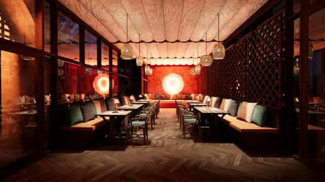 Upscale banquet restaurant with long-table seating for VIP dinners and networking events.