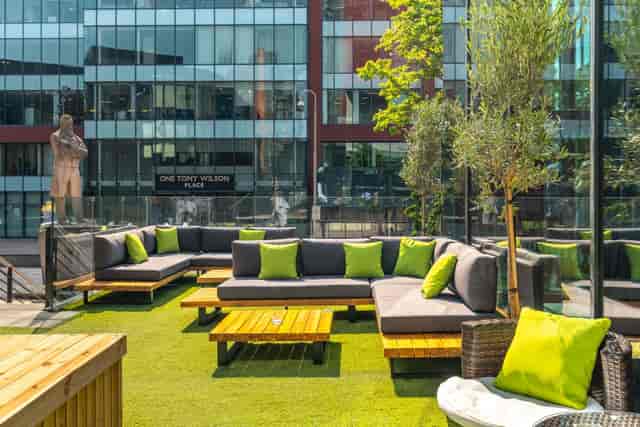 Modern rooftop terrace with lounge seating for corporate networking and business events.