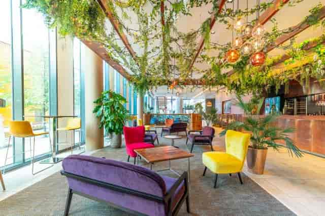 First Street Bar & Kitchen breakout space with vibrant seating for networking and collaboration.