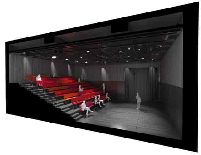 Modern auditorium with tiered seating for events and meetings, ideal for presentations.