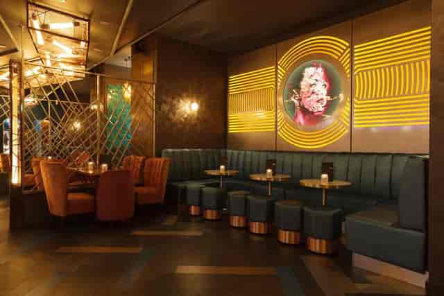 Stylish cocktail bar in Dirty Martini Manchester with plush seating for events.