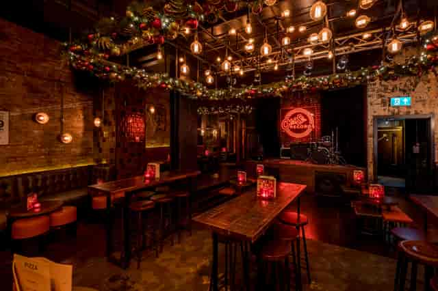 Vibrant event venue with warm lighting, ideal for parties and live performances.
