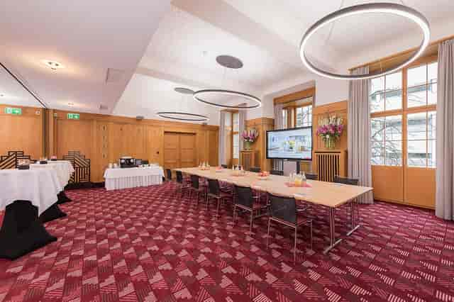 Boardroom meeting space with wood paneling for corporate conferences and professional events.
