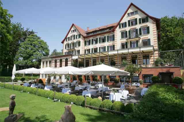 Elegant terrace banquet hall at Hotel Zürichberg for upscale corporate retreats and social events.