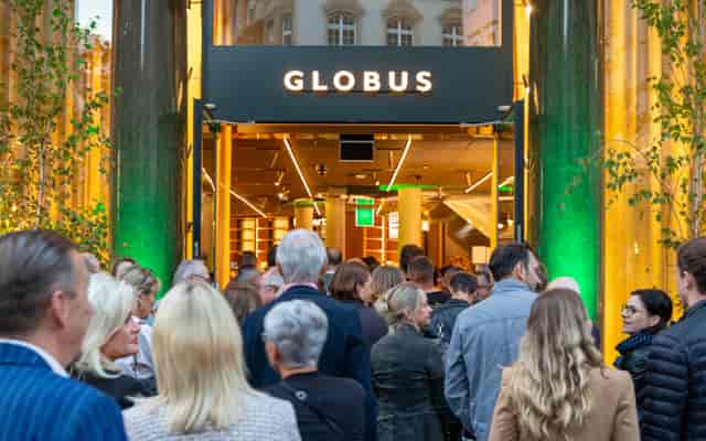 Globus retail store opening: high-end brand activation with strategic lighting.