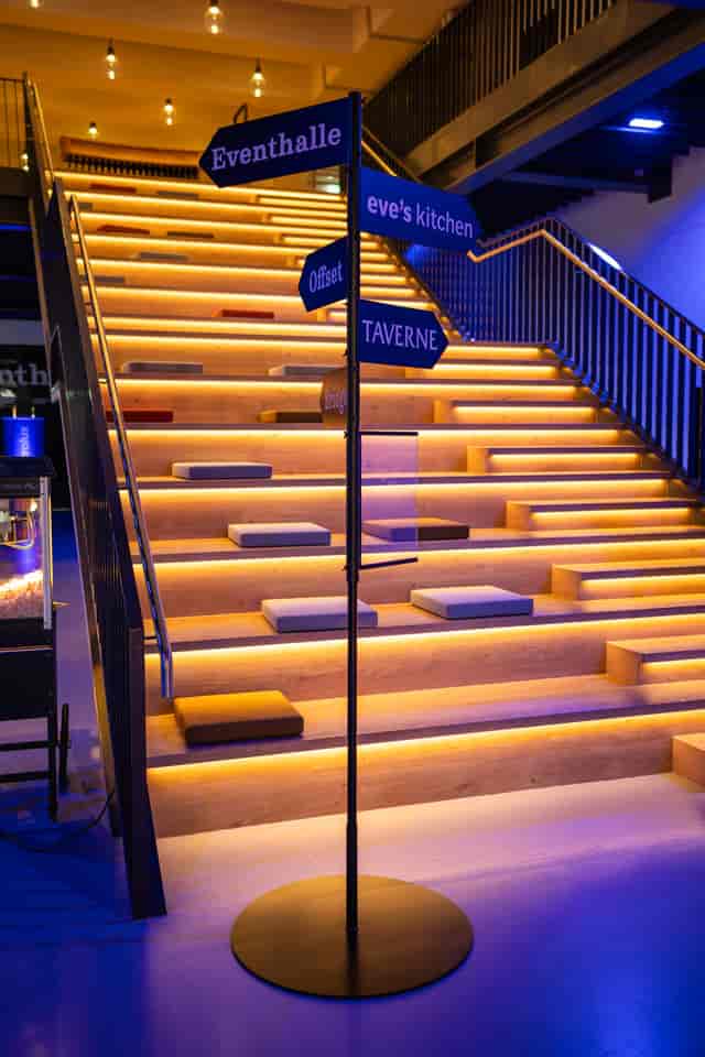 Stadium-style breakout seating in JED Events Foyer J for high-engagement corporate workshops.