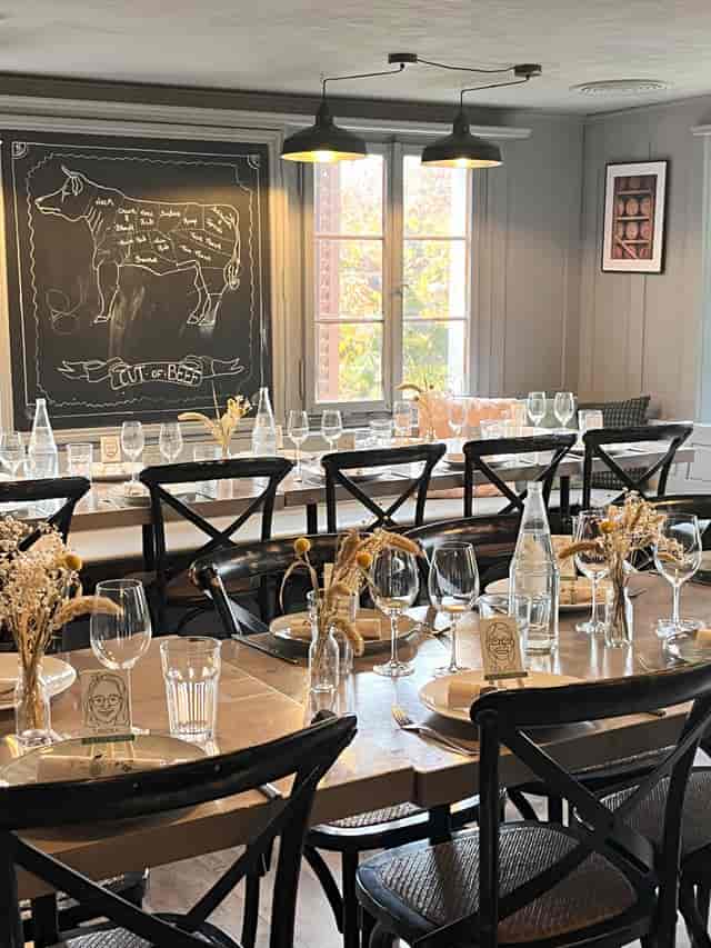 Rustic private dining room with long-table seating for corporate lunch or intimate events.