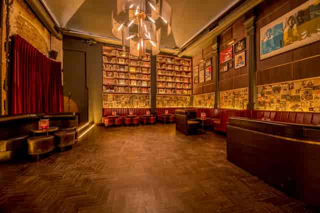 Atmospheric Eastcheap Records lounge with banquette seating for VIP networking and brand events.
