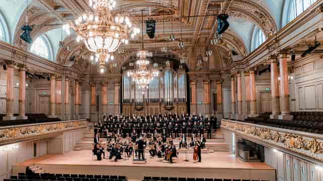 Tonhalle Zürich Konzertfoyer: tiered gala hall with stage lighting for events and ceremonies.