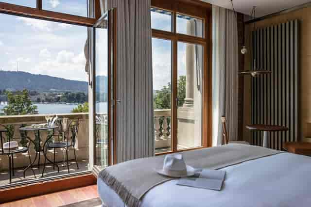 Prestige Balcony Room at La Réserve Eden au Lac Zurich for VIP executive retreats.