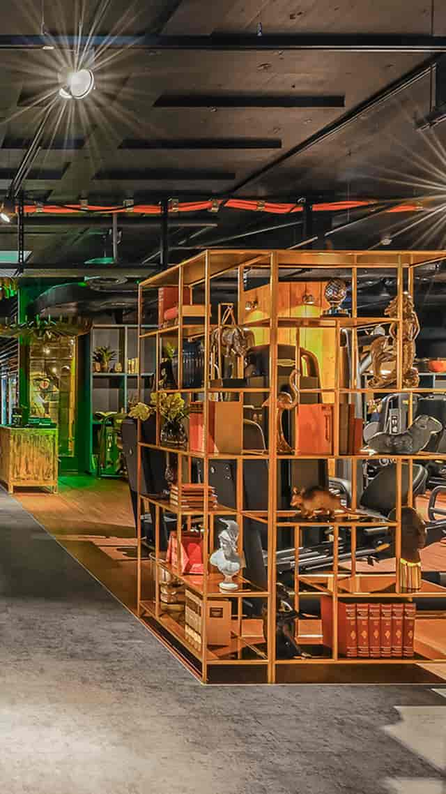 Eclectic GIM Studio Zurich lounge with open shelving for event breakout and networking spaces.