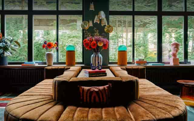 Plush circular lounge seating at The Home Hotel Zürich for VIP networking and boutique events.