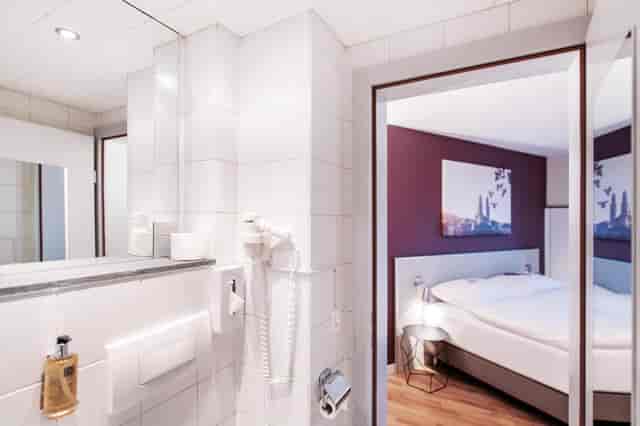 Hotel Rex corporate conference room with compact guest area for business travel and event bookings.