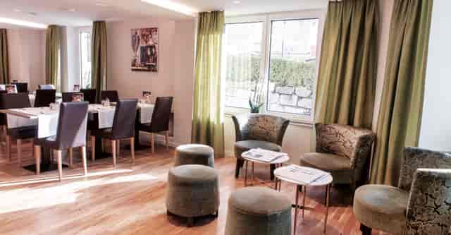 Hotel Rex conference room with lounge area for intimate business networking and strategy meetings.