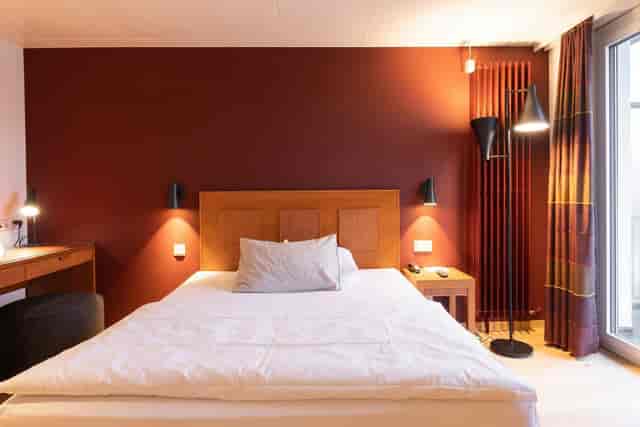Limmatsaal hotel room with workspace for business travel and corporate events.