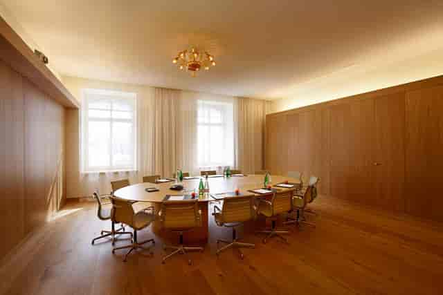 Boardroom at The Historic with wood finishes for executive meetings and corporate events.