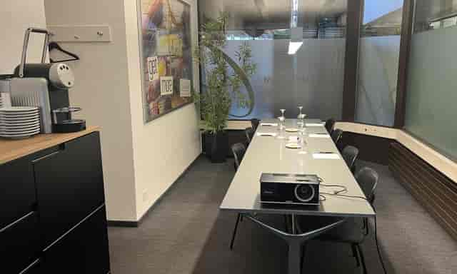 Boardroom at Central Plaza Hotel Zurich with AV equipment for corporate meetings and events.