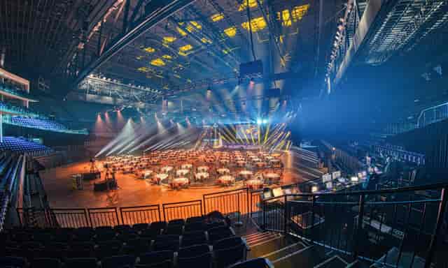 Hallenstadion gala dinner setup with professional lighting for corporate events and award ceremonies.
