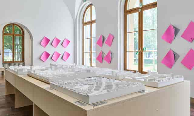 Minimalist ZAZ Bellerive function room with architectural models for corporate showcases or networking.