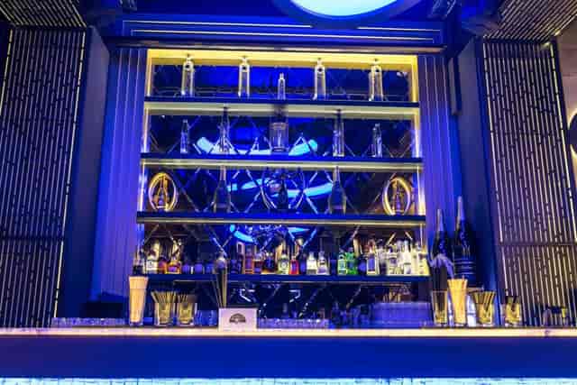 Upscale Lounge bar with backlit shelves for corporate cocktail hours and premium evening receptions.