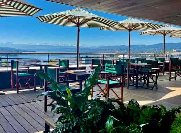 Rooftop cocktail bar at HAUTE with panoramic views for luxury corporate networking events.