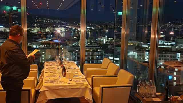 VIP client dinner at HAUTE lounge featuring luxury skyline views for executive events.