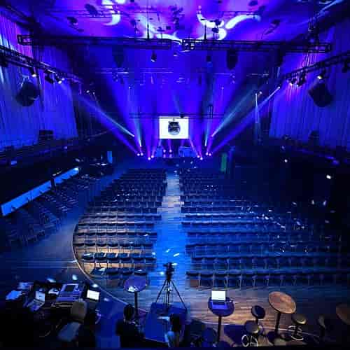 Kir Royal dance hall with stage and dramatic lighting for professional keynote presentation event.