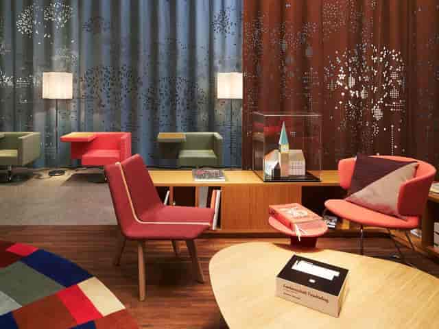 Atrium breakout space at 25hours Hotel Zürich West with modular seating for corporate events.