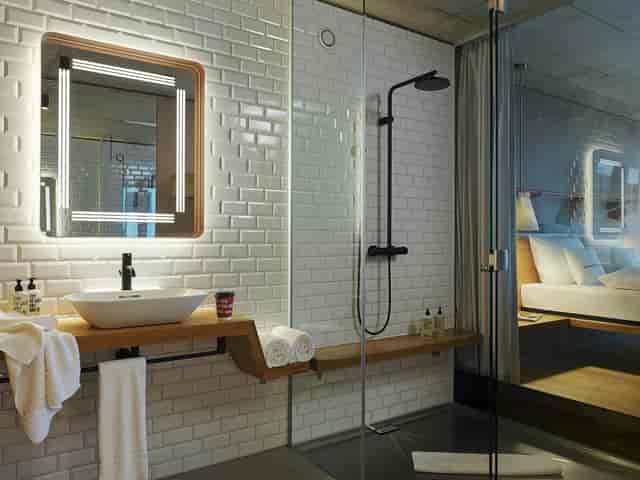 Modern Freiraum hotel room at 25hours Zurich for group events and VIP travel.