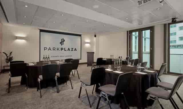 Battersea Suite meeting room with round tables, ideal for corporate events and conferences.