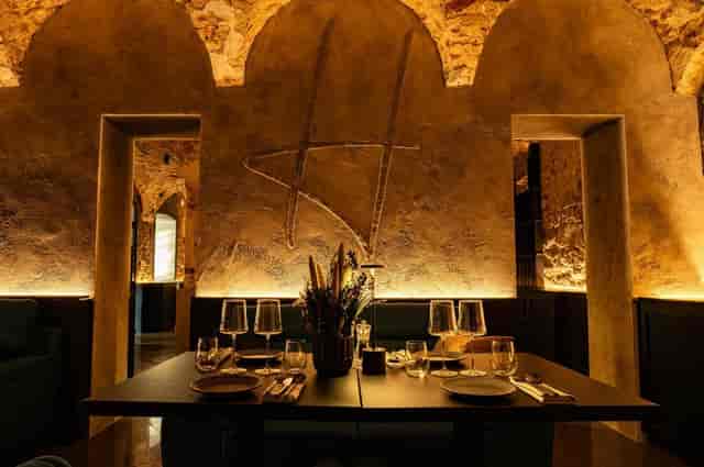 Sophisticated Harper Woolf cafe with textured stonework for corporate dinners and VIP meetings.