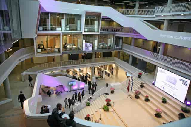 Modern atrium conference room with stadium seating for corporate events and brand activations.