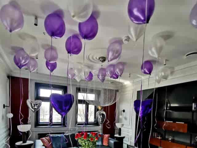 Purple and silver balloon ceiling decor at A22 Hotel for corporate meetings and event venues.
