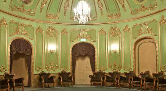 Green Hall ballroom with ornate architecture for luxury product launches and VIP corporate events.