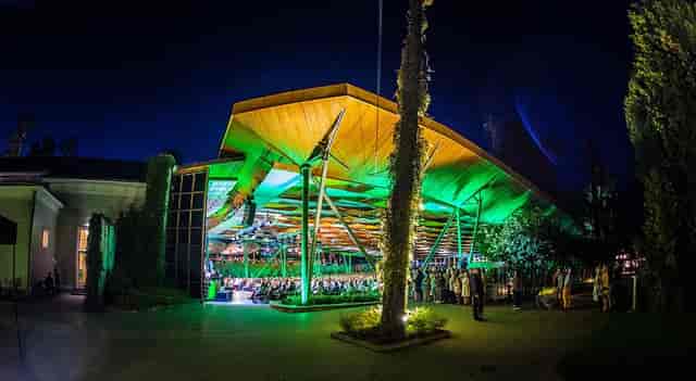 Dzintari Concert Hall green lighting for corporate event reception.