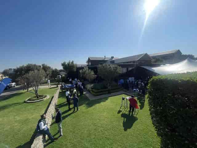 Corporate breakout session on Langhams estate lawn, outdoor business event venue.