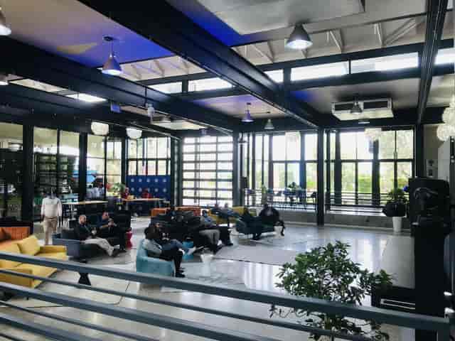 Industrial-chic Bistro venue with lounge seating, ideal for corporate workshops and networking.