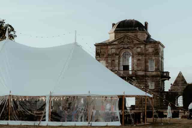 Worcester Lodge event setup: elegant marquee with historic backdrop for premium outdoor weddings.