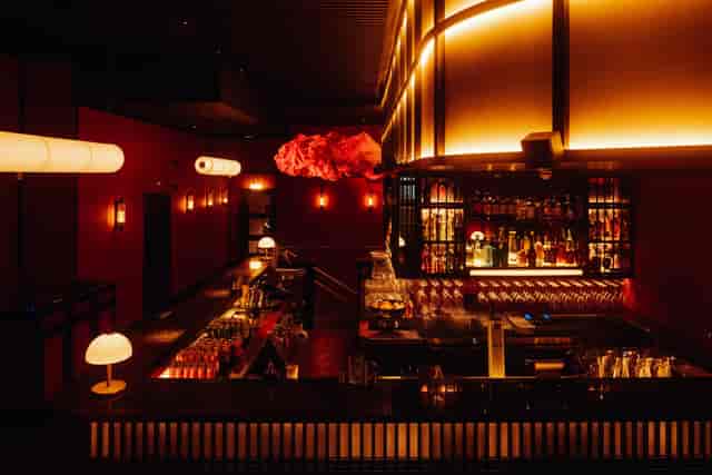 Moyagi cocktail bar with moody lighting, ideal for intimate evening receptions and cocktail hours.