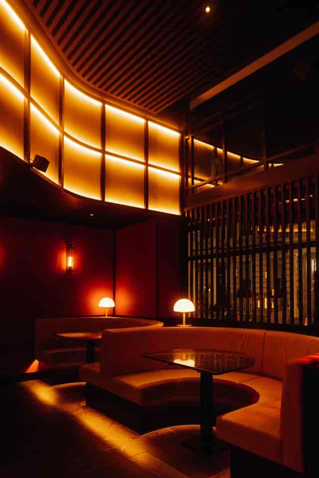 Moyagi cocktail bar with plush curved booths, ideal for upscale networking and VIP events.
