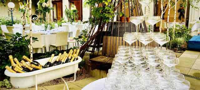 VIENNABallhaus beverage station with champagne tower and vintage ice tub for event catering.